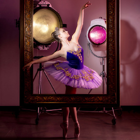Creative Designs in Lighting advertisement photo of ballarina Amber Skaggs.