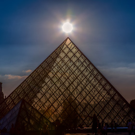 The pyramid at the entrance to the Lourve Museum in Paris, France