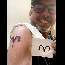 Mark Greenawalt gets tattooed in Athens Greece and it's a zodiac Aries sign