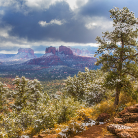 The remnants of a snowy New Year's Day over the red rocks of Sedona.