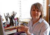 Sarah Clemens painting in her studio