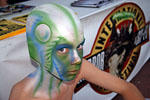 Airbrushed painting on bald cap and face