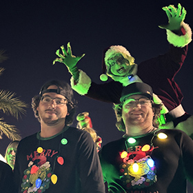 Mark Greenawalt as the Grinch at the Chandler Parade of Lights 2024 in the Junk Brothers dumpster.