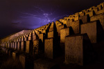 Breaking Bad Dam in New Mexico with lighting strike in a purple sky.